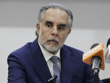 The Minister of the Interior, Armando Benedetti, looks on during the presentation of the q