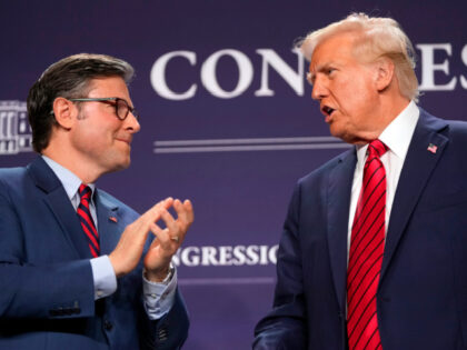 President Donald Trump looks to House Speaker Mike Johnson of La., before he speaks at the