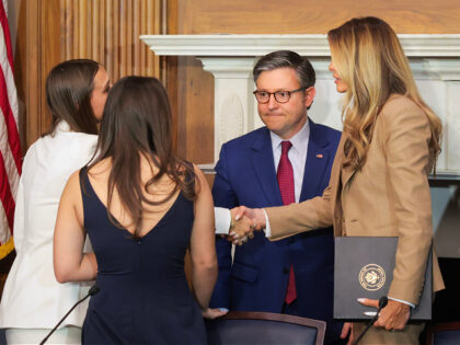 WASHINGTON, DC - MARCH 03: U.S. first lady Melania Trump (R) shakes hands with Francesca M