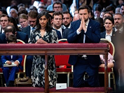 VATICAN - 2025/04/18: U.S. Vice President James David Vance and his wife pray while kneeli