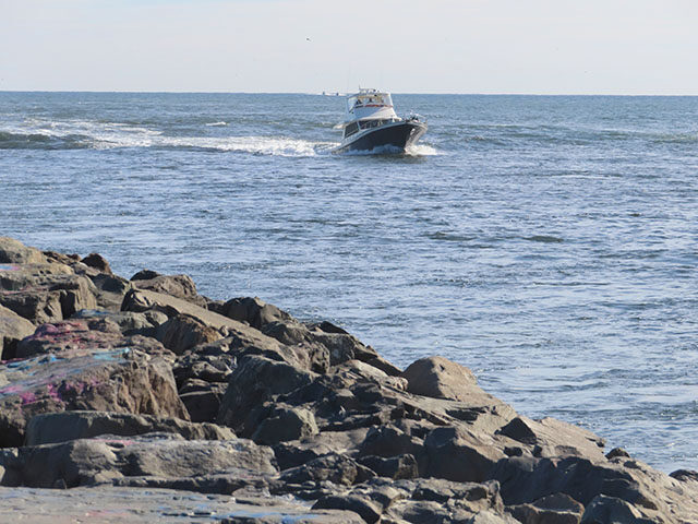 A boat enters the Manasquan Inlet in Manasquan, N.J. on Nov. 15, 2024. (AP Photo/Wayne Par