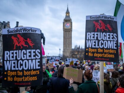 Hundreds pf people gather in Westminster with loud voices and placards to stand against pl