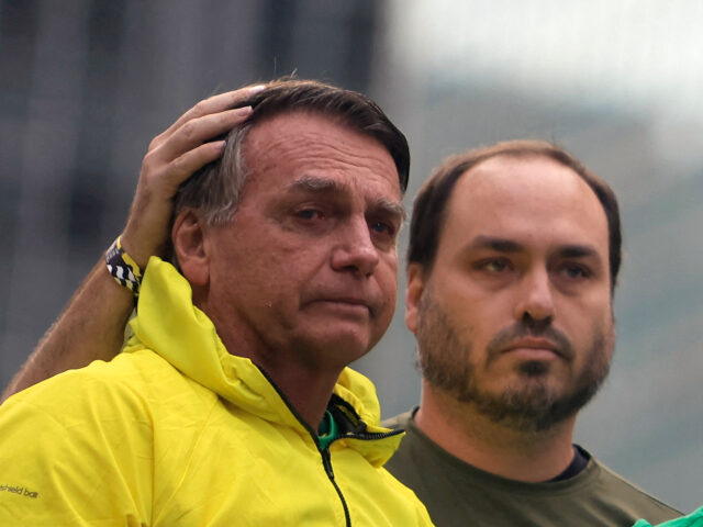 Michelle Bolsonaro (R) speaks next to her husband Brazil's former President Jair Bols
